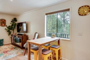 a dining room with a table and chairs and a window at 2 Mi to Arizona Christmas City! Cabin with Fireplace in Prescott