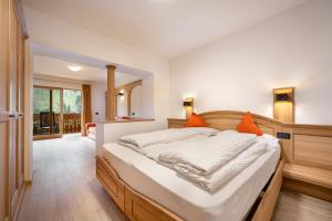 Postel nebo postele na pokoji v ubytování Hotel Brunello