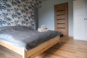 Posteľ alebo postele v izbe v ubytovaní KANIA Apartamenty - Zakopane