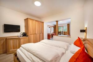 Postel nebo postele na pokoji v ubytování Hotel Brunello