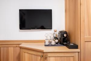 TV a/nebo společenská místnost v ubytování Hotel Brunello