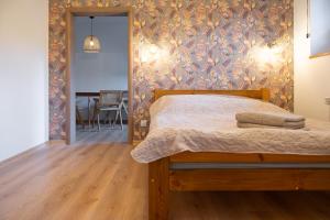 Posteľ alebo postele v izbe v ubytovaní KANIA Apartamenty - Zakopane