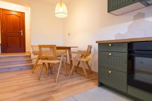 Kuchyňa alebo kuchynka v ubytovaní KANIA Apartamenty - Zakopane