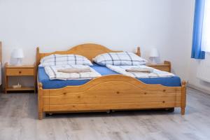 Postel nebo postele na pokoji v ubytování Penzion U Františka