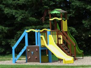 a playground with a slide in a park at Maison de charme avec terrasse privée et activités familiales, proche de Souvigny et St Pourçain sur Sioule - FR-1-489-93 in Meillard