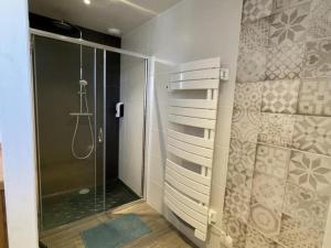 a bathroom with a shower and a glass shower stall at Gîte nature à St Léon avec jardin et WIFI - FR-1-489-440 in Saint-Léon