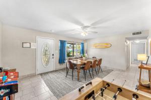 a dining room with a table and chairs at 721 Java Rd in Cocoa Beach