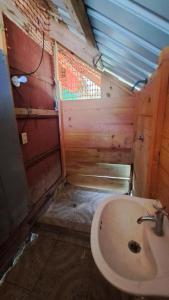 a bathroom with a toilet and a sink at Cabaña Privada en San Blas in Waisalatupo