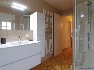 a white bathroom with a sink and a shower at Retraite paisible en maison traditionnelle, 4 chambres, jardin arboré, cheminée et nature luxuriante. - FR-1-497-154 in Saint-Cornier-des-Landes +27 photos