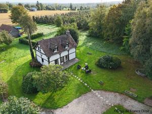 an aerial view of a house in a field at Maison familiale confortable avec grand jardin, proche nature et commodités, Saires-la-Verrerie - FR-1-497-194 in Saires-la-Verrerie