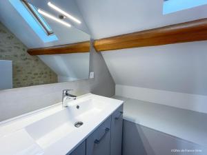 a bathroom with a sink and a mirror at Charmante maison en pierres restaurée, WIFI, 2 ch. - FR-1-497-241 in La Mesniere +13 photos
