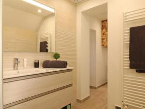 a bathroom with a sink and a mirror at Maison de caractère avec jardin, idéale pour famille, animaux acceptés, randonnée, loisirs à proximité - FR-1-497-161 in Saint-Germain-de-Martigny +25 photos