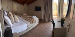 Ένα ή περισσότερα κρεβάτια σε δωμάτιο στο Sami Loft