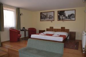 Postel nebo postele na pokoji v ubytování Hotel Banderium