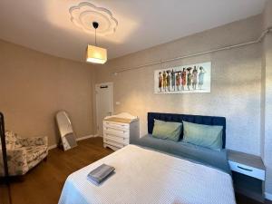 a bedroom with a bed and a dresser in it at The istanbul Arnia Apartment in Istanbul