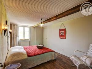 a bedroom with a bed and a sign on the wall at Gîte familial 14 pers. avec piscine chauffée, spa, sauna, terrains de jeux et borne électrique. - FR-1-496-3 in Vivans +28 photos