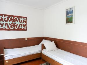 Rúm í herbergi á Bozui Hostel