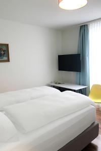 Postelja oz. postelje v sobi nastanitve Hotel Garni dei fiori