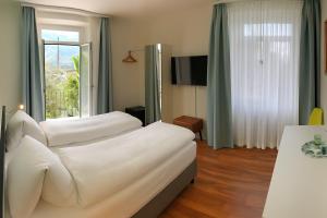 Postelja oz. postelje v sobi nastanitve Hotel Garni dei fiori