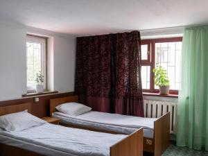 Rúm í herbergi á Bozui Hostel