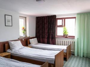 Rúm í herbergi á Bozui Hostel