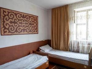 Rúm í herbergi á Bozui Hostel