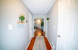 a hallway with white walls and a white door at Lush Hideaway with HotTub & Pool 6 mins kings Island in Mason
