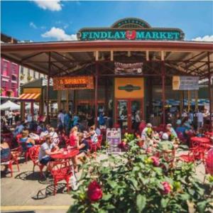 a group of people sitting outside of a farmers market at Lush Hideaway with HotTub & Pool 6 mins kings Island in Mason