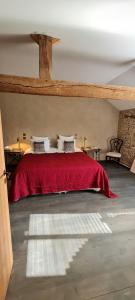 a bedroom with a bed with a red blanket at Wine Estate Loft Among Vineyards In Gers in Maumusson-Laguian +7 photos