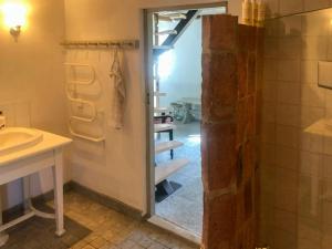 a bathroom with a shower and a sink at Traditional Scanian Farmhouse Near Sandhammaren Beach in Löderup +21 photos