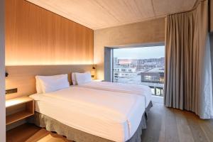Letto o letti in una camera di Placid Hotel Design & Lifestyle Zurich