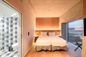 Letto o letti in una camera di Placid Hotel Design & Lifestyle Zurich