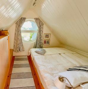 a bedroom with two beds in a tent at Serene Waterfront Oasis Your Resarö Sanctuary in Vaxholm