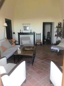a living room with a couch and a coffee table at Historic Villa In Sant Antonino With Sea Views in SantʼAntonino +28 photos