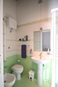 a bathroom with a toilet and a sink at Cosenza Vecchia: arte & storia in Cosenza +29 photos