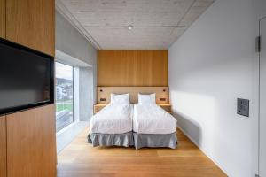 Letto o letti in una camera di Placid Hotel Design & Lifestyle Zurich