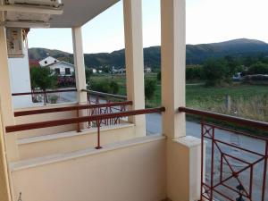 a balcony with a view of the mountains at Hotel Kosmas in Sarti