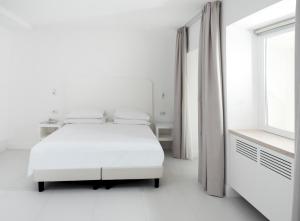 Кровать или кровати в номере Hotel Posa Posa