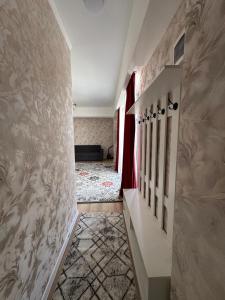 a hallway of a home with a hallway at Берег 5 in Bosteri +2 photos