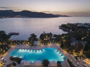 an aerial view of a resort with a large swimming pool at DoubleTree by Hilton Bodrum Isil Club Ultra All-Inclusive Resort in Torba