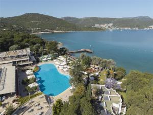 an aerial view of the resort and the lake at DoubleTree by Hilton Bodrum Isil Club Ultra All-Inclusive Resort in Torba +37 photos