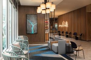a lobby with chairs and a waiting room at Hyatt Place National Harbor in National Harbor