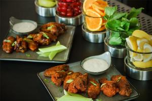 a table topped with plates of food with appetizers at Hyatt Place National Harbor in National Harbor