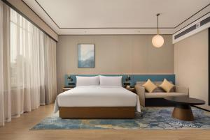 Postel nebo postele na pokoji v ubytování Hilton Garden Inn Chengdu Jinniu Yipintianxia + 37 fotografií