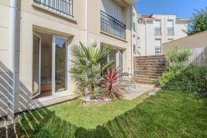 Κήπος έξω από το Bel Appartment à 5 min de Disneyland Paris - Parking gratuit