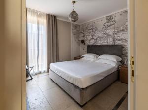 Voodi või voodid majutusasutuse La Dépendance Hotel toas