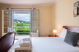 Ένα ή περισσότερα κρεβάτια σε δωμάτιο στο GuestReady – Charming Getaway by Madeira's Nature