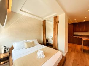 Ένα ή περισσότερα κρεβάτια σε δωμάτιο στο The Elegance stay