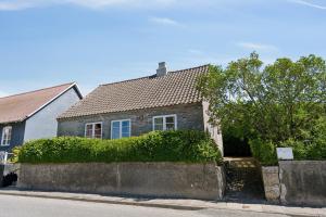 a house on the side of a street at The Cozy Cottage in Hirtshals