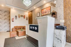 a large room with a table with an oo sign on it at SPOT ON Hotel Umang in Zirakpur